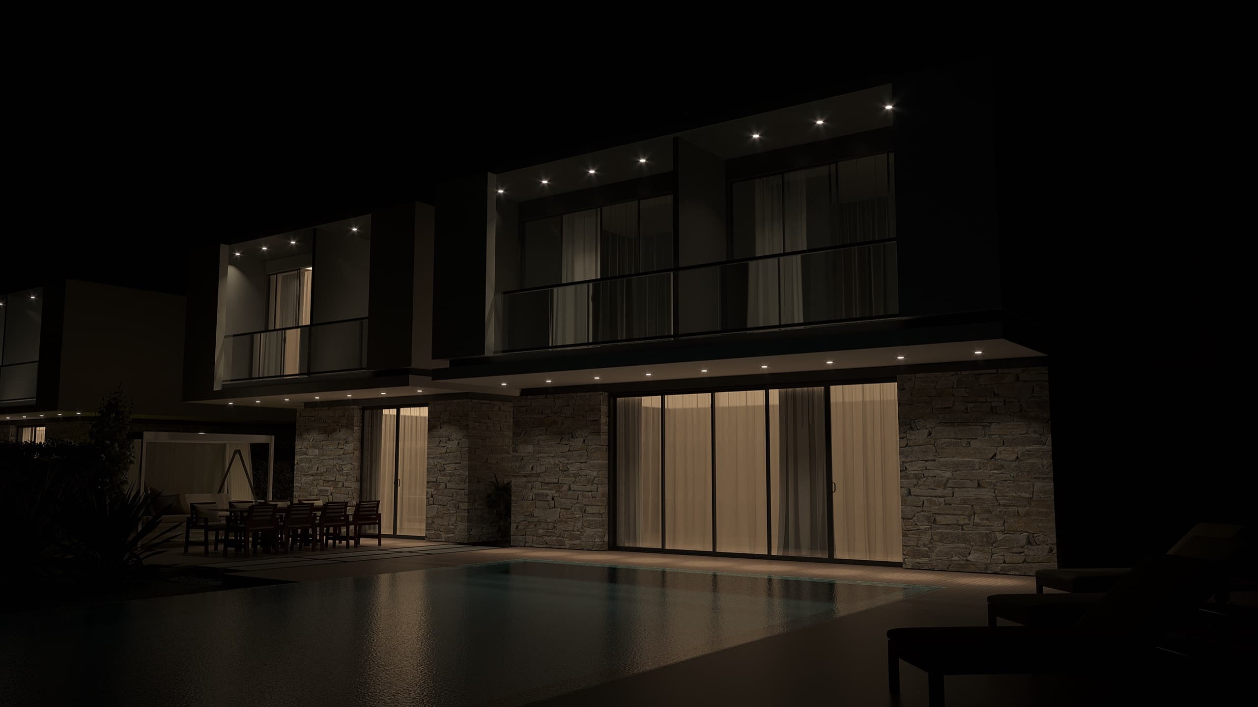 Pool deck with sun loungers facing the villa's glass living wall