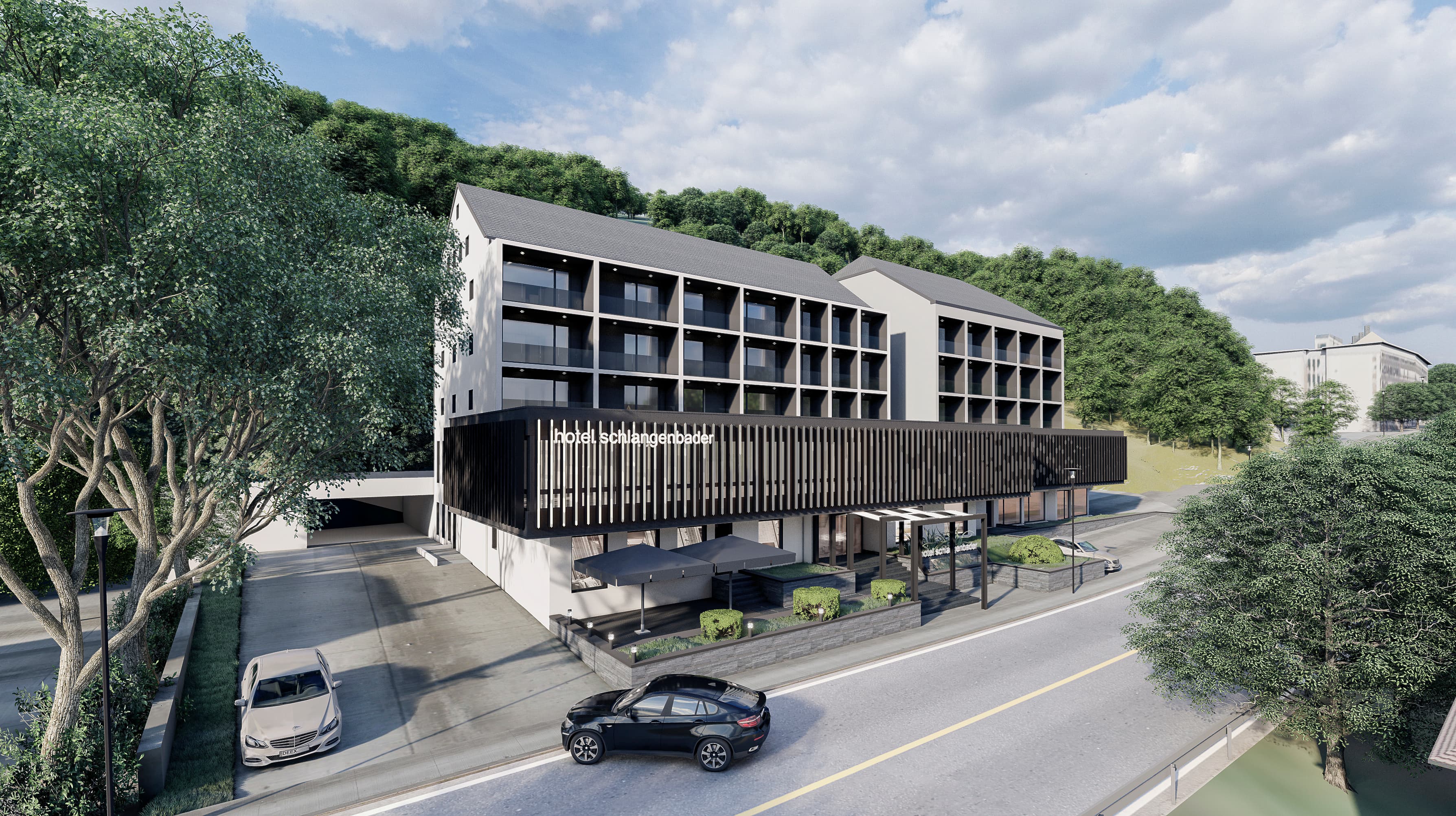 Yapının kırma çatı hatları köy geleneğini yansıtırken, cepheleri modern bir kimlik ortaya koyuyor.