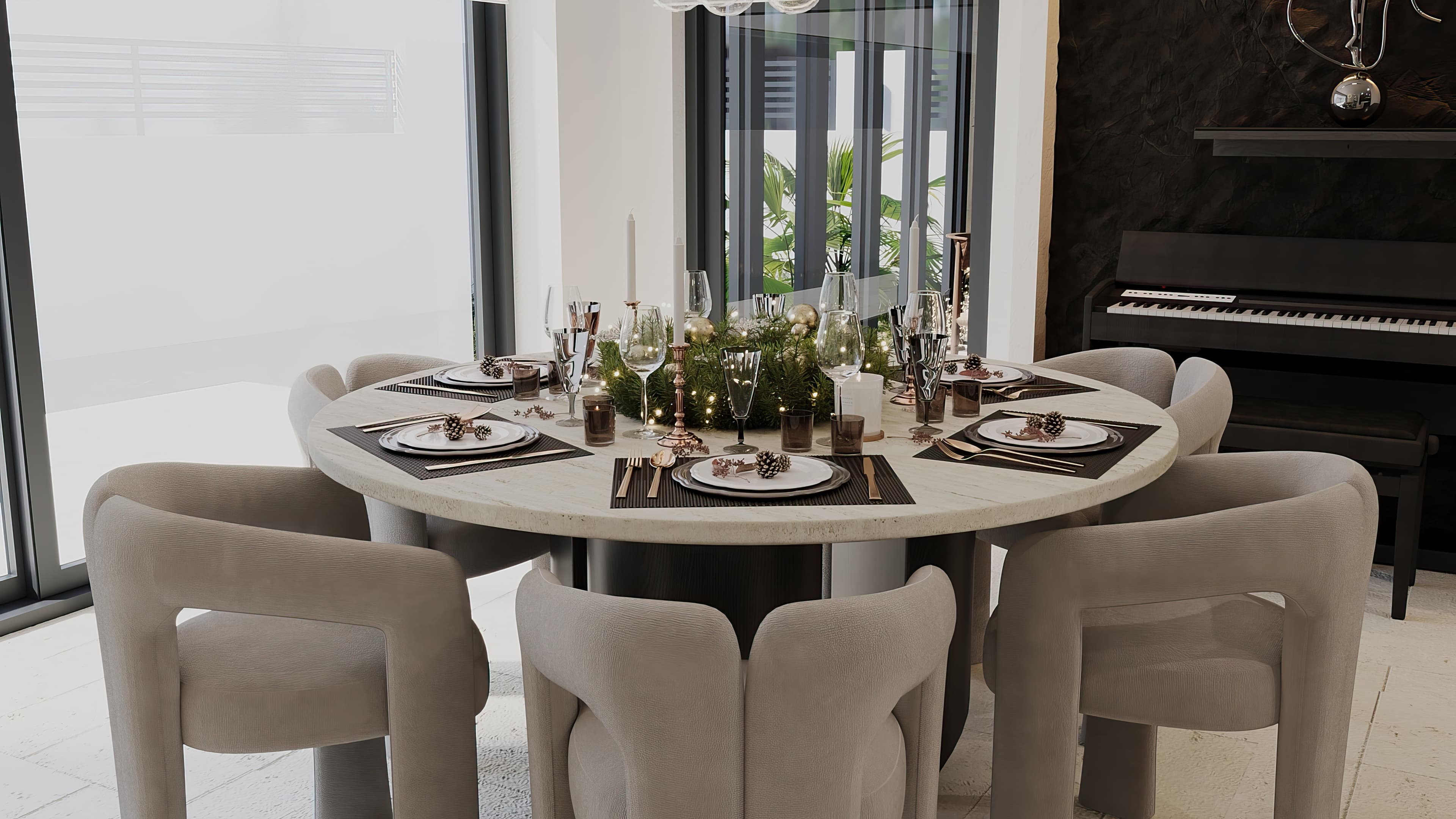 Close-up of round dining table with holiday place settings and piano behind