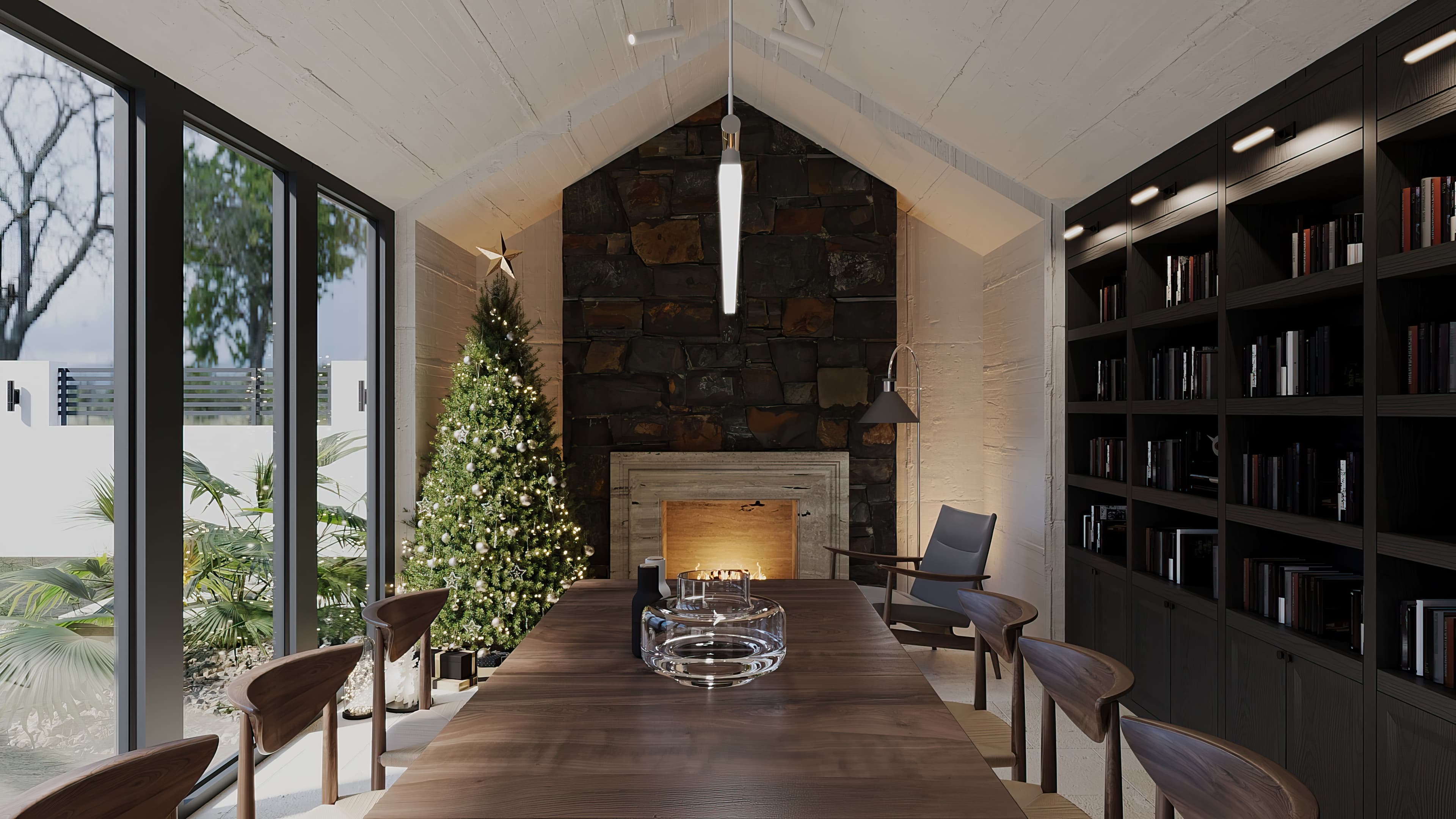 Gabled library with stone fireplace, walnut dining table, and Christmas tree