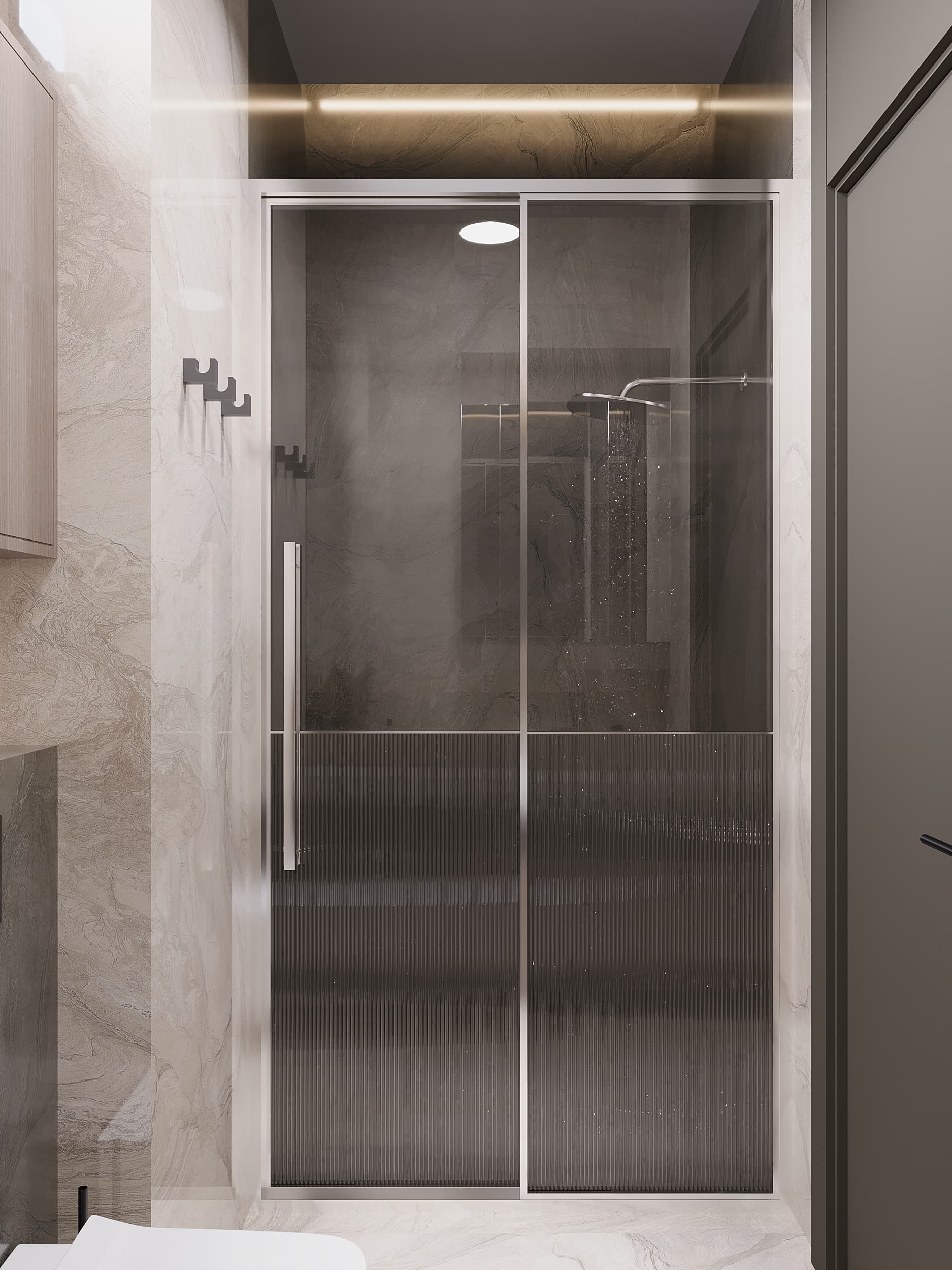 Glass shower enclosure with tinted doors and marble walls