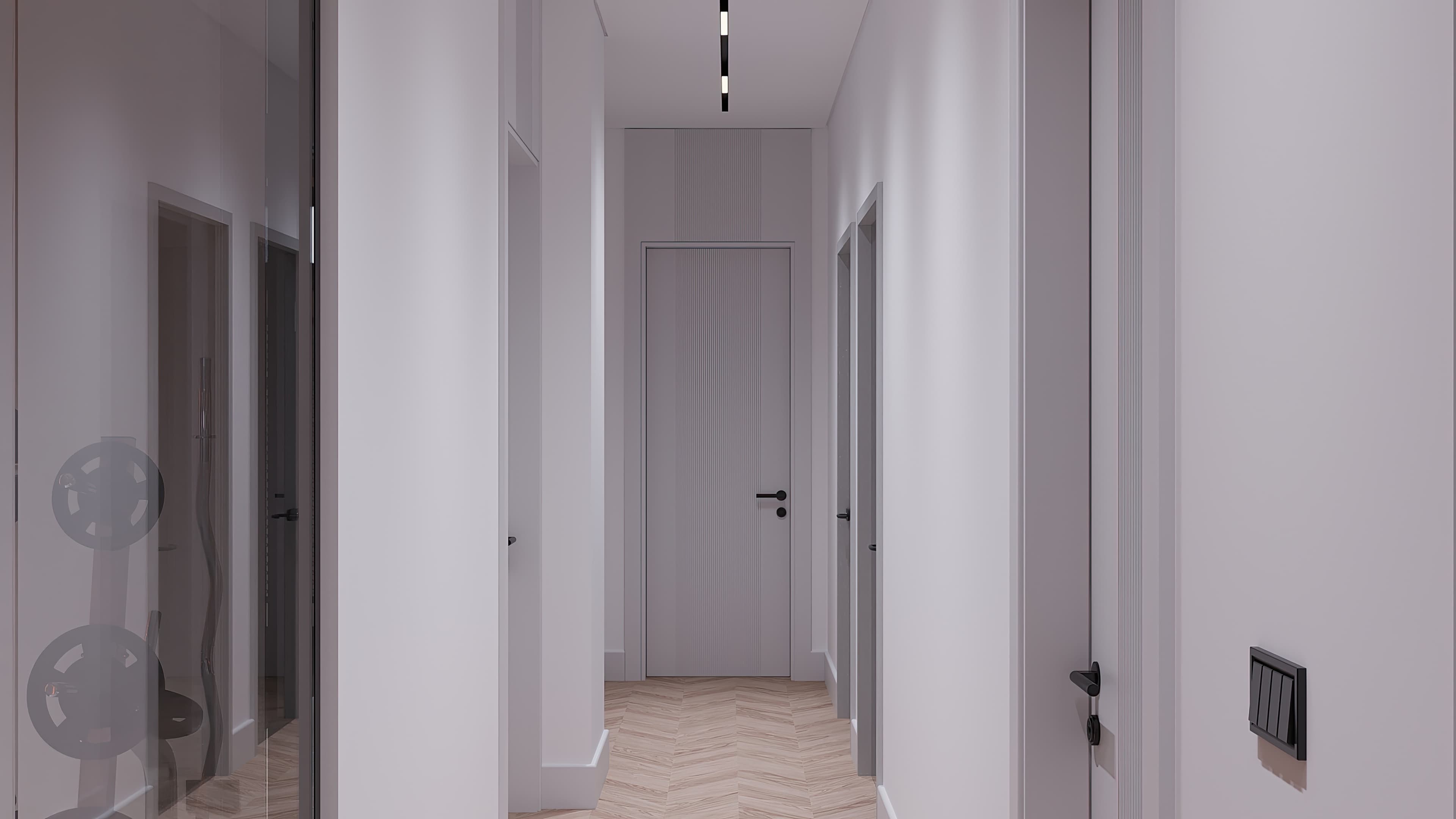 Long white corridor with herringbone parquet and linear ceiling light
