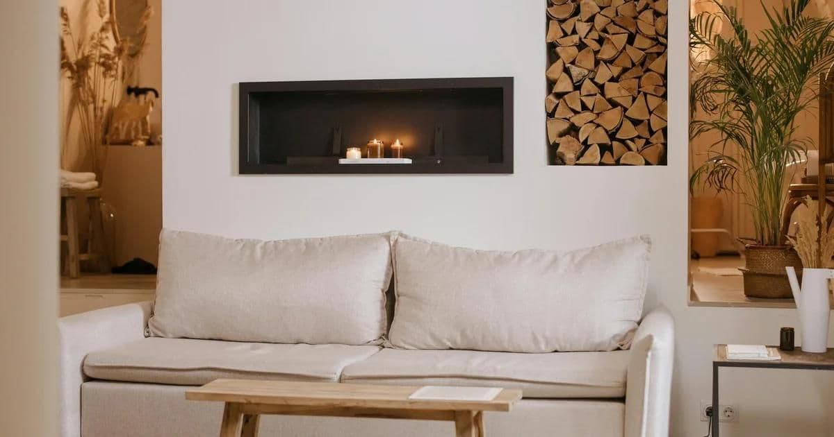 Japandi interior living room with low timber furniture, neutral tones, and wabi-sabi ceramics