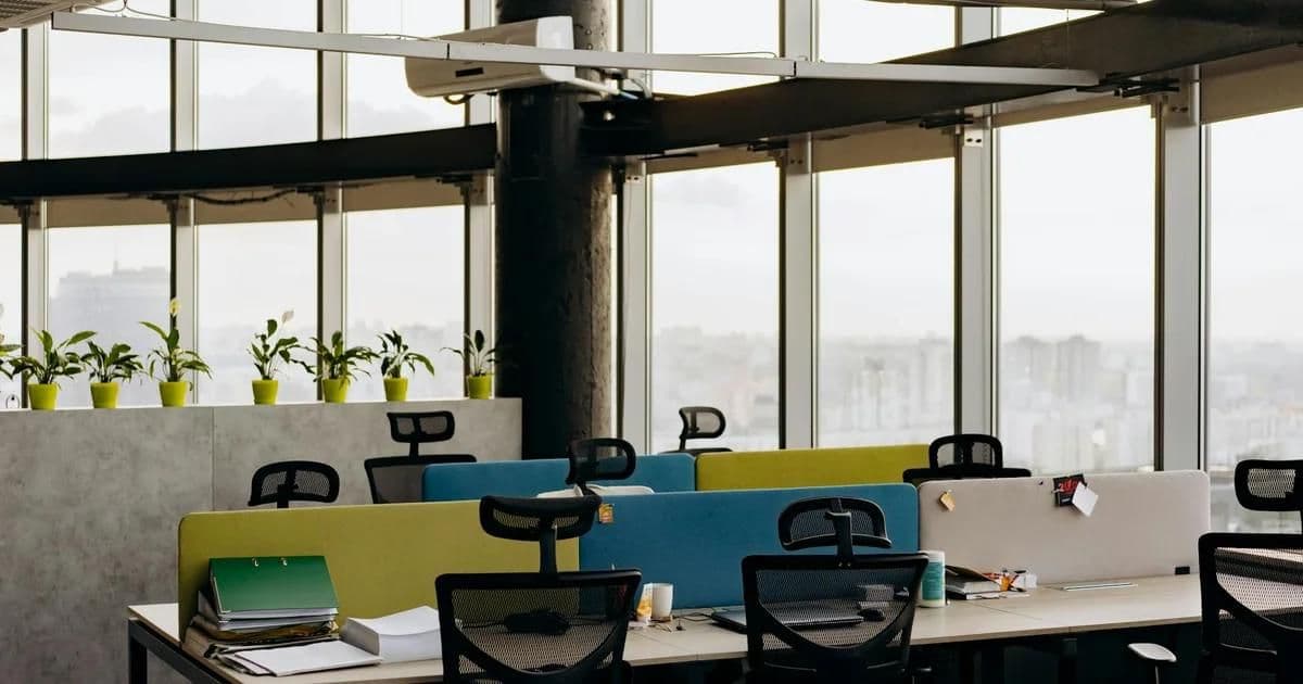 Split view of open plan workspace and private office showing different layout approaches