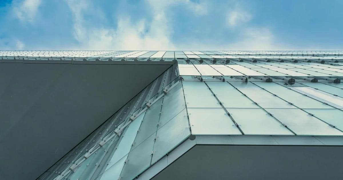 Double skin facade glass layers on a modern commercial building showing ventilation cavity