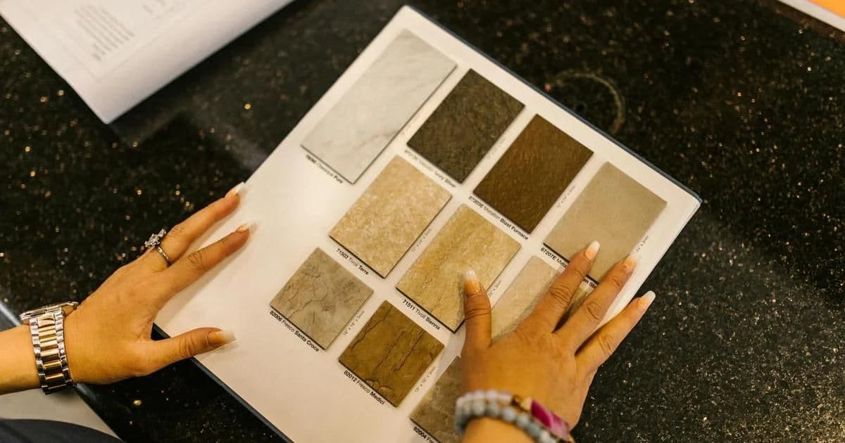 Client and interior designer reviewing material samples and mood boards at a design consultation