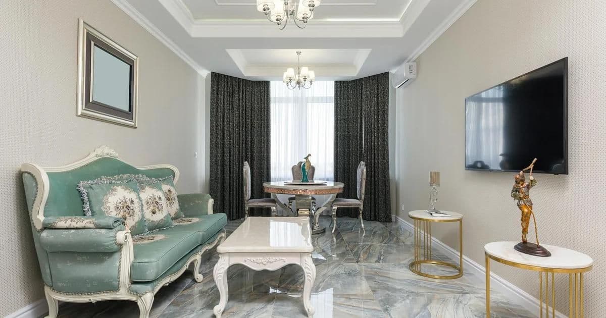 Travertine and marble flooring samples side by side showing color and texture differences