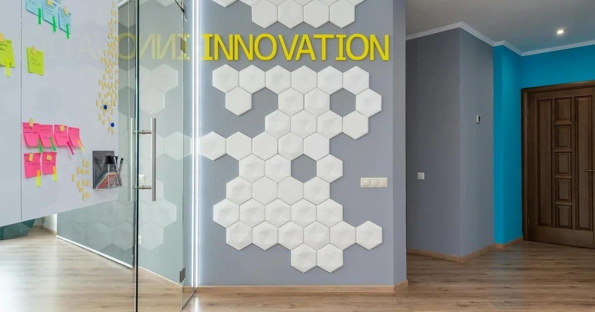 Productive office interior with ergonomic workstations, natural lighting, and acoustic panels